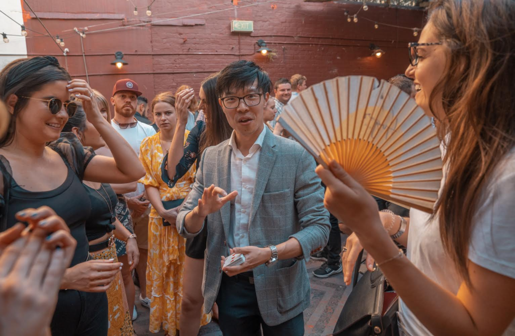 Roving magician Sydney entertaining guests with close-up magic